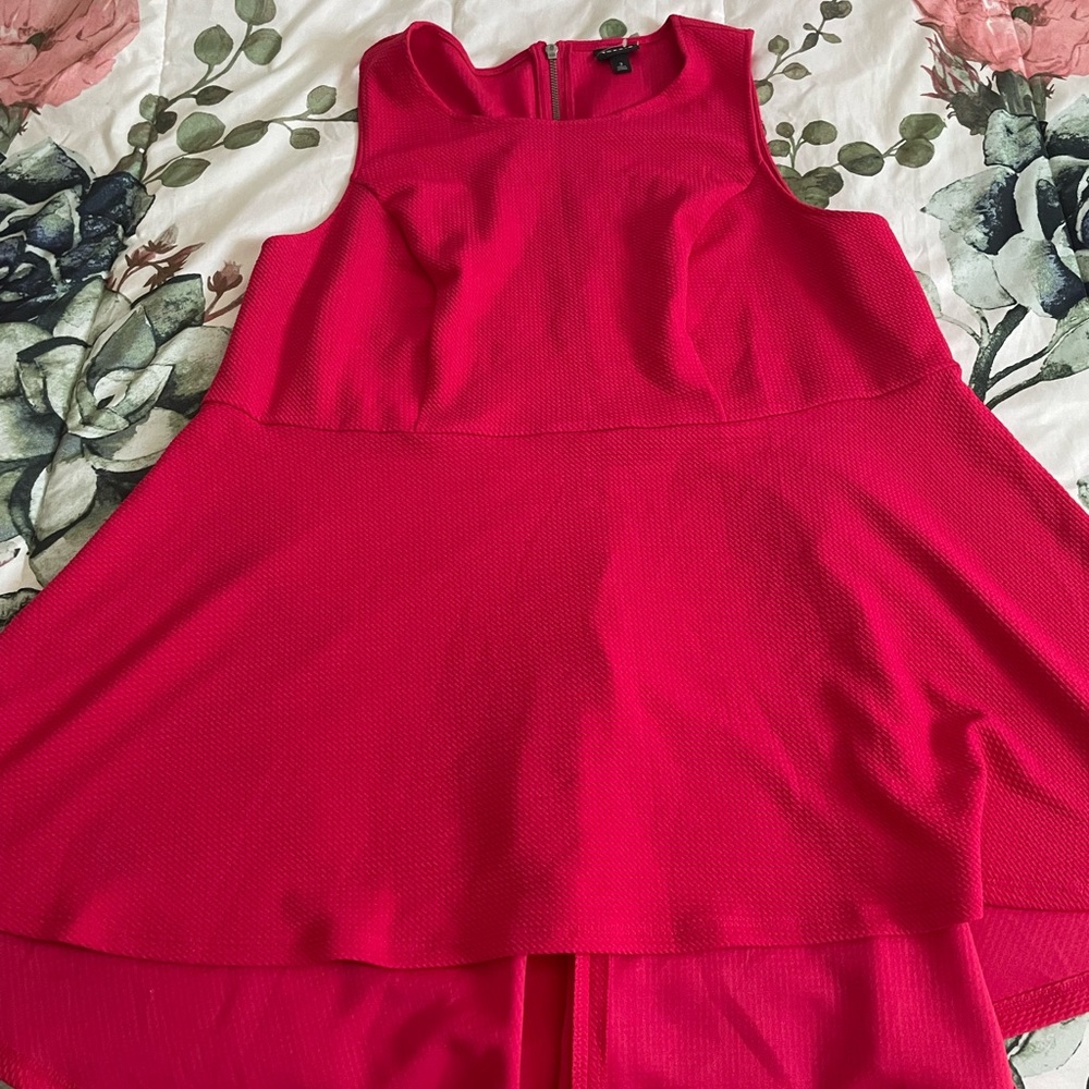 Torrid. Peplum high low top. Brand new without tags. Never worn. $25 size 3